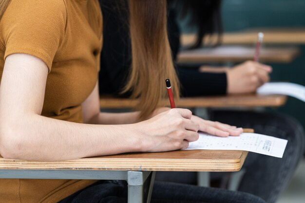 University students focusing on passing exams in class