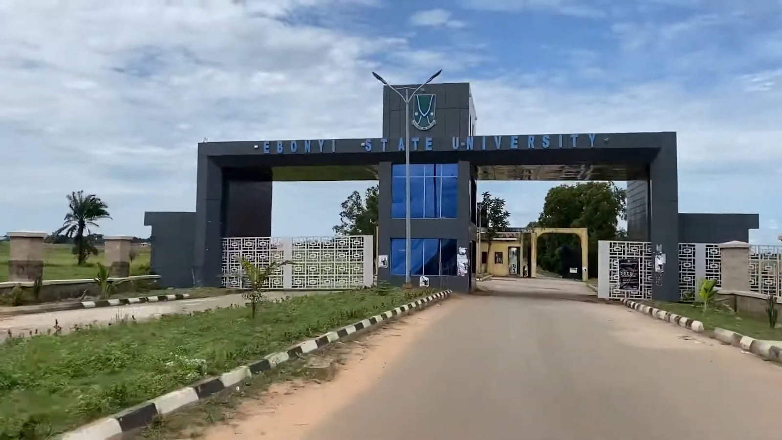 Main gate of Ebonyi State University with clear blue skies above